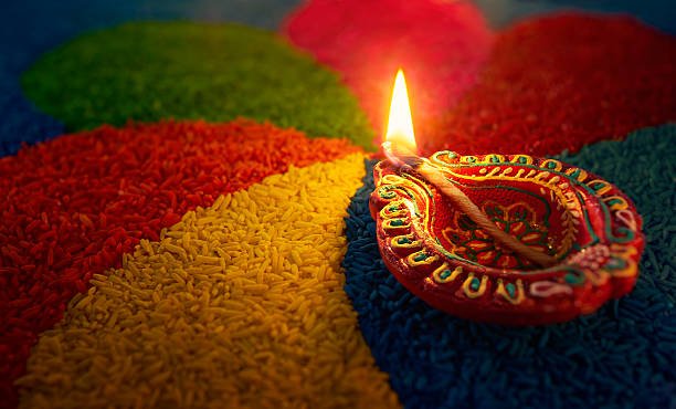 Diwali Diya welcomes with a warm glow on colored rice rangoli. ELESAAR — Explore Freely Trade Transparently | Elesaar Landing Page